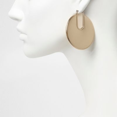 Gold tone disc hoop earrings